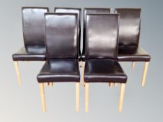 A square contemporary travertine dining table together with six stitched leather chairs