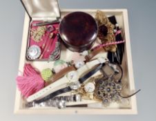 A collection of costume brooches, wrist watches,