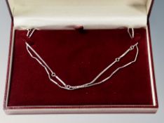 Two decorative long silver ball chain and rolo type necklaces,