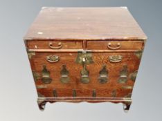 A Korean elm low cabinet fitted with drawers,