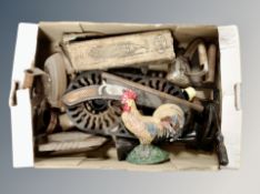 A box of antique and later cast iron flat irons, punch two ring burner,