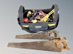 A Stanley fabric tool bag/caddy containing hand tools and saws
