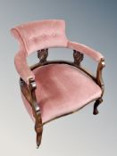 A late 19th century carved beech armchair in green dralon