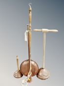 An antique copper beech handled bed warming pan together with two further copper poss sticks,