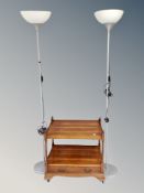 A yew wood two tier trolley / occasional table fitted a drawer together with a pair of uplighters