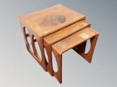 A nest of three teak tables,