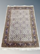 An Iranian Tabriz rug on cream ground,