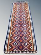 A Turkish fringed runner 282 cm x 100 cm