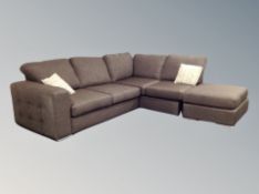 A dark brown cloth corner settee,