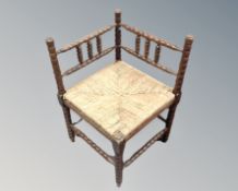 An oak bobbin turned corner chair