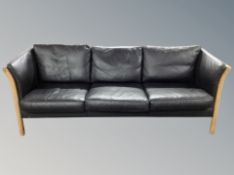 A Danish black leather three seater settee