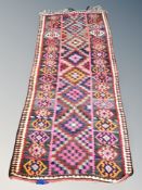 An Afghan fringed runner 260 cm x 105 cm
