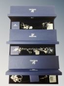 A Swarovski charm bracelet and two further pendants,