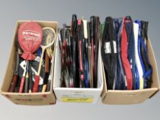 Three boxes of tennis and badminton rackets