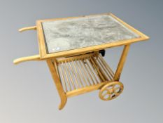 A Scandinavian blond oak serving trolley with galvanised top