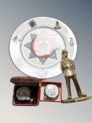 A cast brass figure of a policeman,