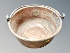 A 19th century copper swing handled cooking pot,