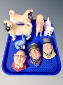 A Beswick palomino horse and two pug ornaments,