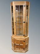 Foxman : A Malcolm Pipes English oak corner cabinet,