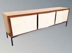 A 1960's Wilkes Berger teak and melamine six door sideboard,