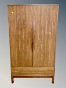 A Duffs of Lisburn teak double door wardrobe,