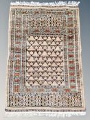 An Iranian prayer rug on coffee ground 92 xm x 61 cm