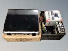 A contemporary turn table / radio together with a crate containing digital camera,