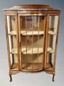 An Edwardian mahogany bow fronted display cabinet,