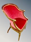 A Scandinavian beech armchair with carved rams head arm rests