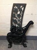 A cast iron garden bench frame