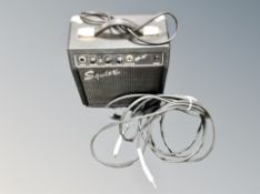 A Squier SP10 guitar amplifier with lead