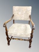 A Scandinavian oak armchair in floral upholstery