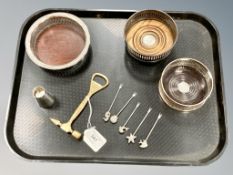 Three silver plated bottle coasters, together with five cocktail sticks in the form of sea life,