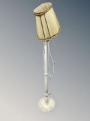 A cream standard lamp
