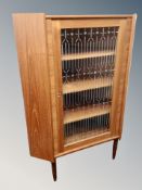 A Danish teak glazed corner cabinet