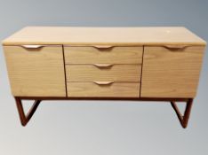 A 20th century teak effect low sideboard,