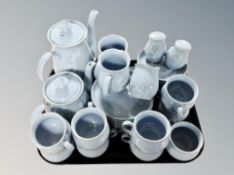 Thirty three pieces of Denby stoneware tea and dinner china on blue ground