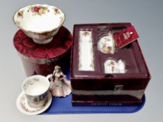 A Royal Albert Old Country Roses bowl and three piece cabinet china set,