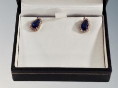 A silver stone set pair of earrings