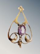 A gold amethyst pendant
