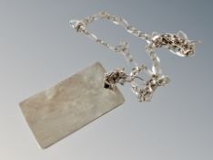 A silver ingot and chain