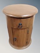 A Sheesham wood cylinder cabinet fitted with a drawer