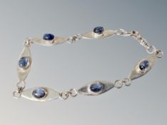 A silver stone set bracelet