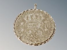 A coin in pendant mount