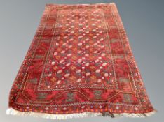 An Iranian rug on red ground,