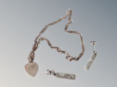 A silver anklet and earrings