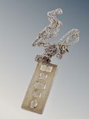 A silver ingot on chain