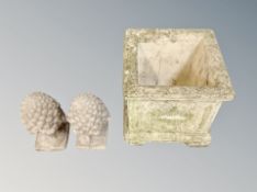 A square concrete classical planter together with a pair of pineapple finials