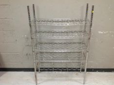 A metal five shelf wine rack