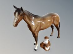 A Beswick horse and a John Beswick figure two otter cubs